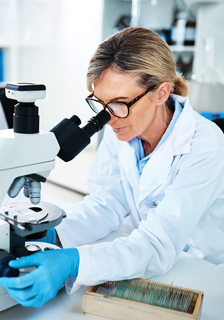Cover of the Sagis Diagnostics case study, showing a scientist at a microscope